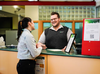 Crows Nest Customer Service staff with customer