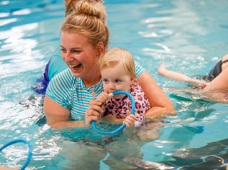 Mother in pool with baby