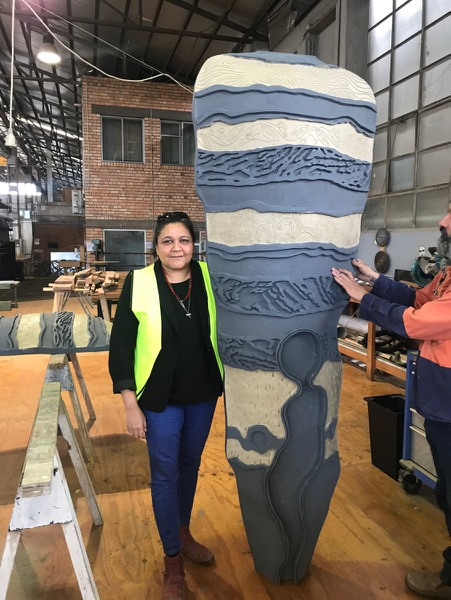 Artist with Baiame installation