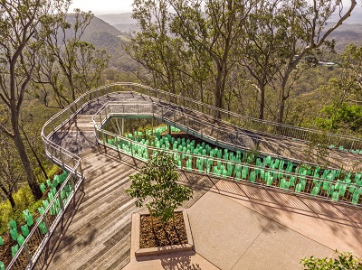 Looking down on the Picnic Point Tobruk Drive Memorial Lookout. Wooden boardwalk stretching out over the edge of the escarpment with stunning views of Table Top Mountain.