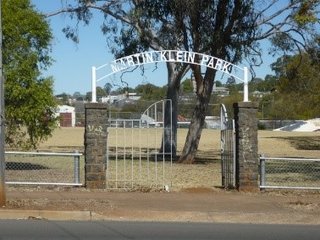 The metal and stone entrance gates of Martin Klein park.