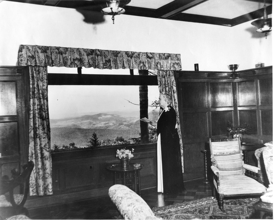 Black and white photo of Sister Elizabeth Kenny looking out window in Struan house. View of the Lockyer Valley.
