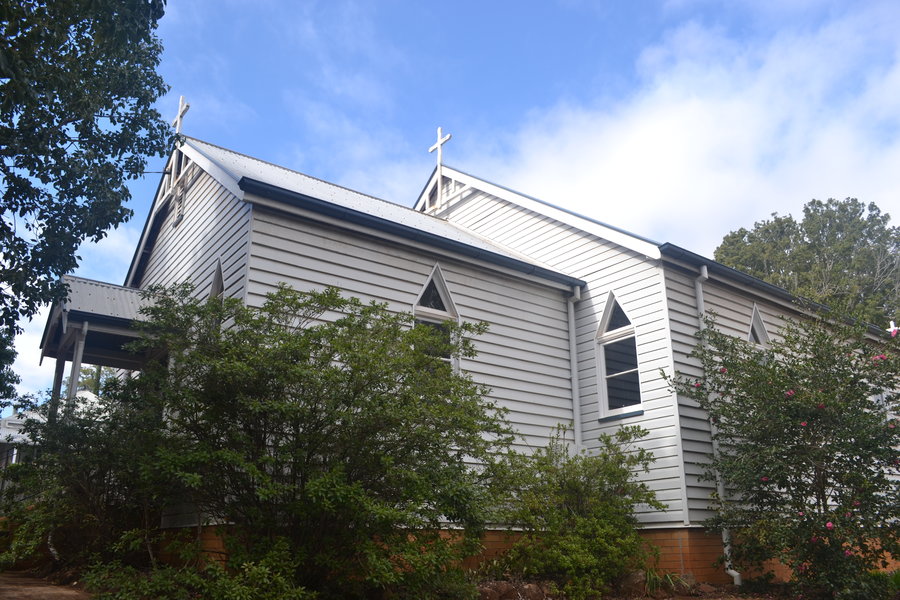 Recent photo of All Saints Church. White wooden building .