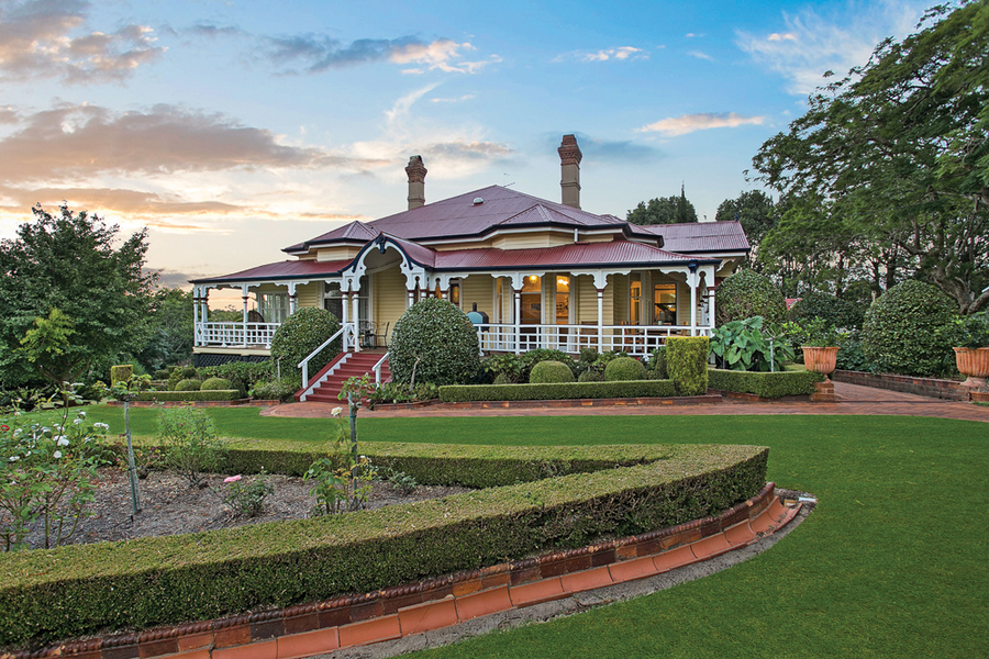 Recent photo of Rodway house. A grand old property surrounded by wide verandas and stairs leading up to the entry. Landscape gardens and lush green grass surround the residence.