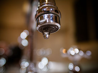 Water leaking from tap
