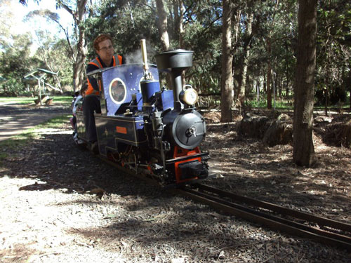 Man on miniature train