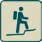 Figure walking on steep ground with backpack