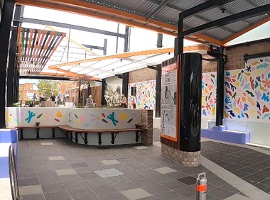 Looking at multi-coloured abstract artwork in Carnival Lane