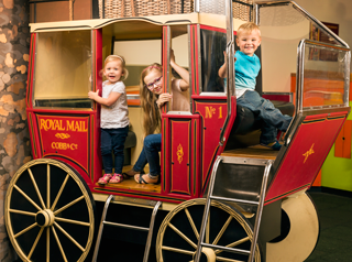 Young children on a play carriage at Cobb & Co museum