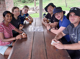 Young people in group around table