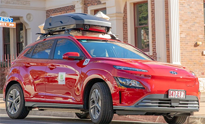 Small red car used to monitor illegally parked cars.